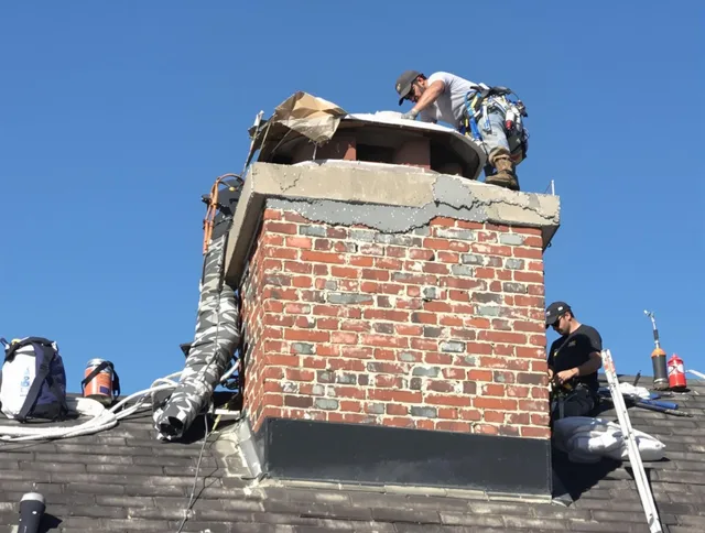 Grove City Chimney Sweep installing a custom chimney crown in Grove City, OH