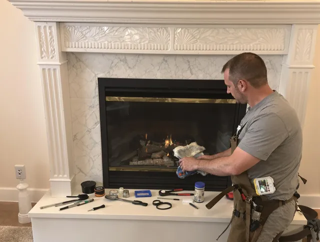 Grove City Chimney Sweep performing fireplace maintenance in Grove City, OH