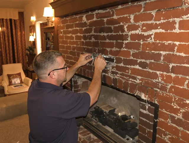 Grove City Chimney Sweep expert fixing a fireplace in Grove City, OH